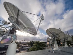 O3B dishes on Port Moresby roof with sun in background