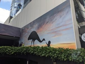 City mural of little kid with emu