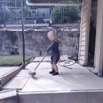 20210925 091146628 backyard julian sweeping laundry pavers