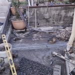 211205 backyard progress gutter and drain - 20211203 170315946 backyard progress new drain at rear of house