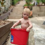 20211226 015849356 backyard julian with bucket watering plants