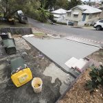 backyard progress tores driveway pour
